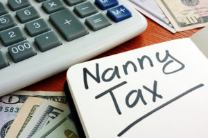 Nanny Tax sign with cash for home budget.